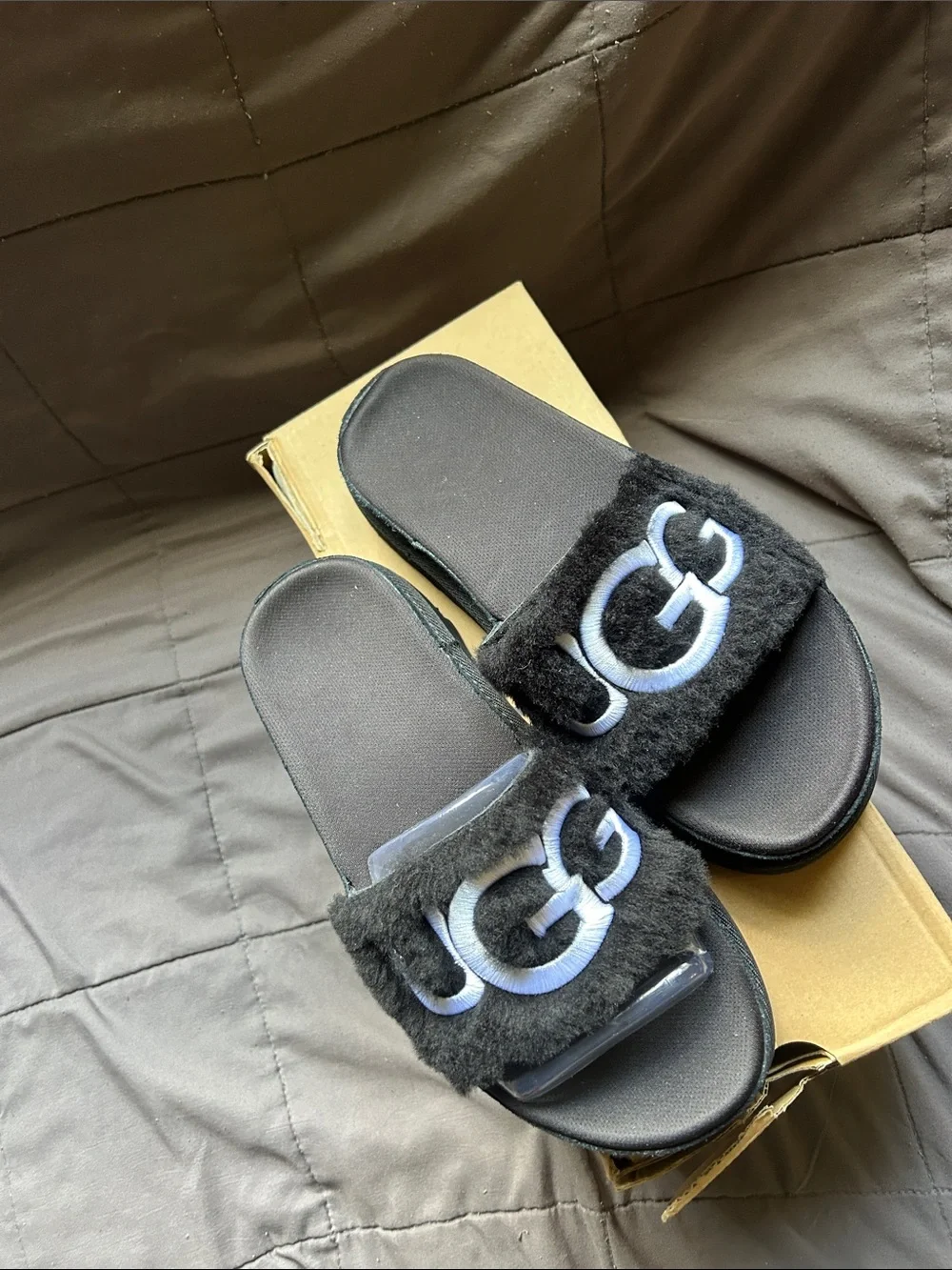 UGG Black Fuzzy Slide Sandals with White Logo